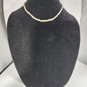 Necklace strand of faux Keshi pearls. 16 inches total length barrel clasp